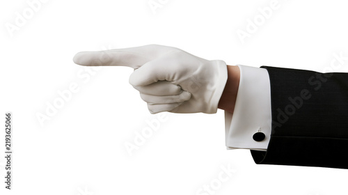 Foto Isolated elegant butler's gloved hand in a formal suit pointing left with index