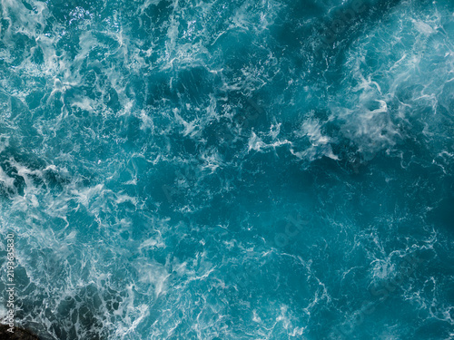 Abstract aerial view of rough ocean waves forming natural water patterns