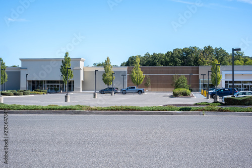 Shopping center parking lot with retail store building exterior