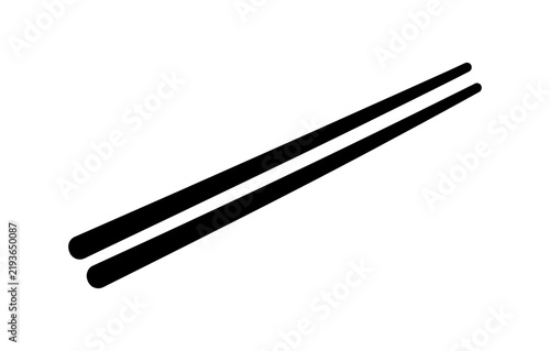 Two black chopsticks laid side by side