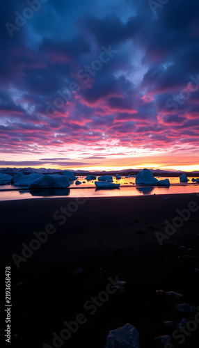 Sunrise on the beach at Jokulsarlon, glowing neon. White tone