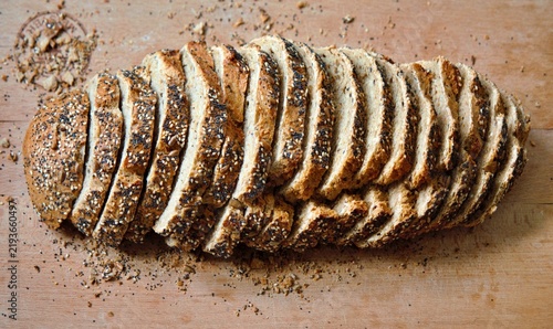 Canvastavla Mainz, Rhineland Palatinate, Germany: Sliced multigrain bread with seeds and crispy crust on wooden cutting board