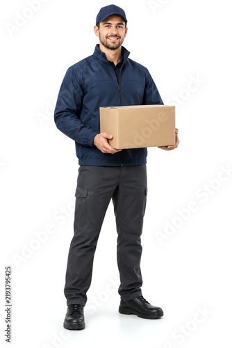 Delivery courier in blue uniform holds cardboard package on white background.