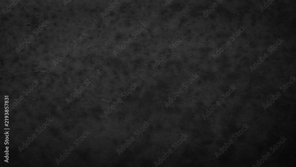 Obraz premium Dark black textured concrete wall background with grunge vignette and mottled pattern. Abstract dark backdrop with rough distressed surface, moody copy space for design.