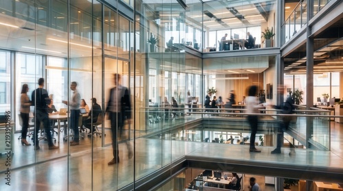 Modern office interior with blurred people working and walking