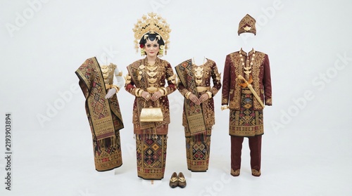 Traditional Indonesian Wedding Attire Featuring Elegant Gold Embellished Songket Fabric for Formal Cultural Ceremonies and Festive Marriage Celebrations