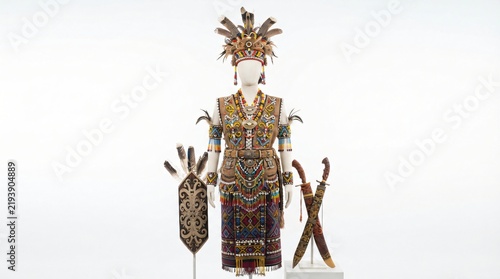 Traditional ceremonial attire and weaponry from indigenous cultures, showcasing intricate craftsmanship and heritage