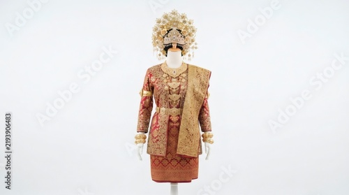 Traditional Palembang Indonesian Bridal Wedding Costume with Golden Crown on Mannequin