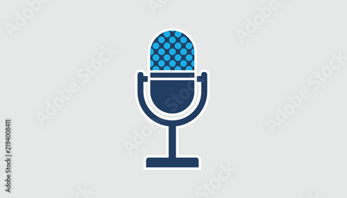Blue and dark blue vintage radio microphone icon sitting isolated on a plain gray background.