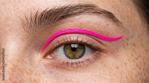 Close Up of Eye Area Featuring Vibrant Neon Pink Floating Liner Art and Natural Freckles Skin