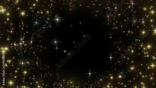 Glittering gold sparkles on black background luxury texture shimmering particles