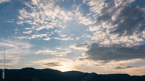 Time-lapse of evening sky changing from orange to deep blue at twilight.