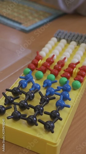 Colorful molecular model kit with plastic atoms and bonds on yellow tray for chemistry science education STEM learning laboratory research and classroom study