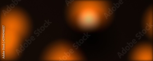 Warm orange bokeh lights on black background, soft glowing amber lens flare circles, abstract golden light leak texture for cinematic overlays and festive holiday designs