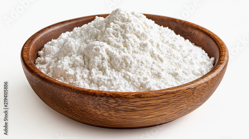 A wooden bowl filled with white cornstarch powder isolated on white background. Useful for cooking and baking ingredient concepts.