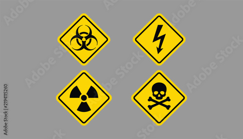 Принти на полотні Yellow diamond hazard warning signs symbolizing biohazard, electrical danger, ra