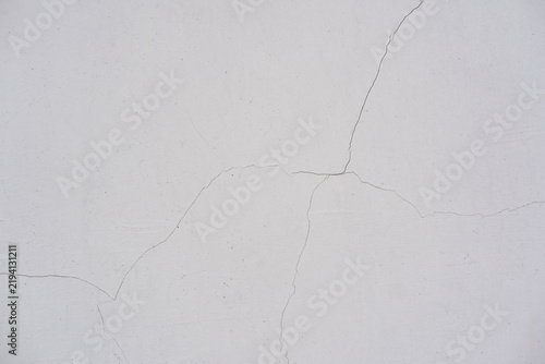 Quadro su tela Texture of fine hairline cracks on a plain white plaster wall surface