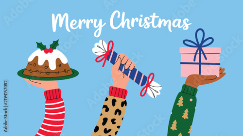 Christmas celebration concept with diverse hands holding a pudding, a cracker, and a gift box against a blue background