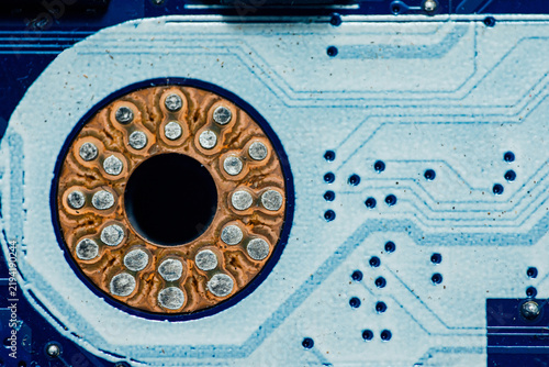 Circuit board close up showing intricate solder joints