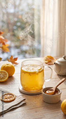 Warm yuzu honey tea with citrus slices and soft steam