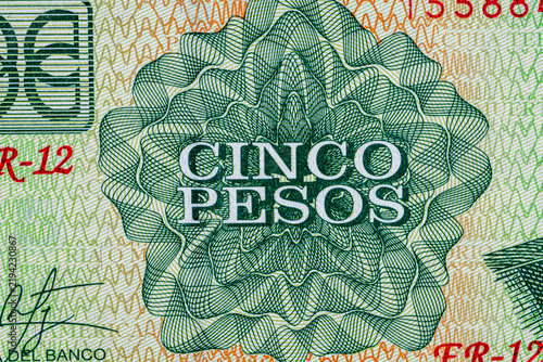 Close-up of a green Cuban 5 pesos banknote featuring . Detailed macro shot of Cuba currency paper money bill, 2019 series.