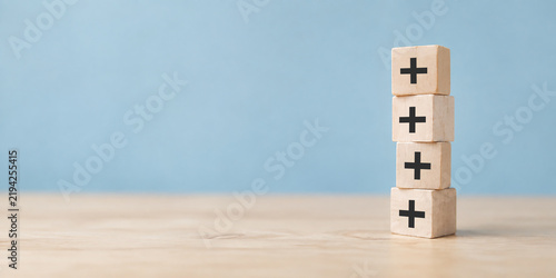 Canvastavla Plus sign in wooden cubes stacking