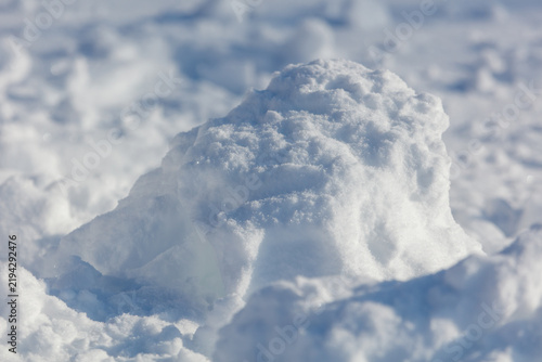 Принти на полотні Soft snow mound rises from snowy field