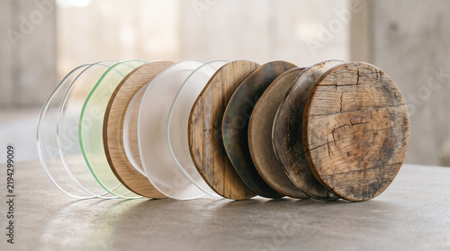Row of mixed material round coasters showing texture progression from glass.