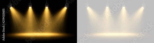 Four warm yellow spotlights shining on a dark and transparent background. Stage lighting effect for events