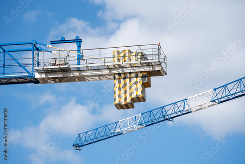 Fotografie Tower Crane Components Against Bright Blue Sky