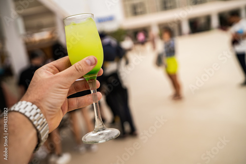 Holding summer cocktail celebrating vacation in marsa alam resort