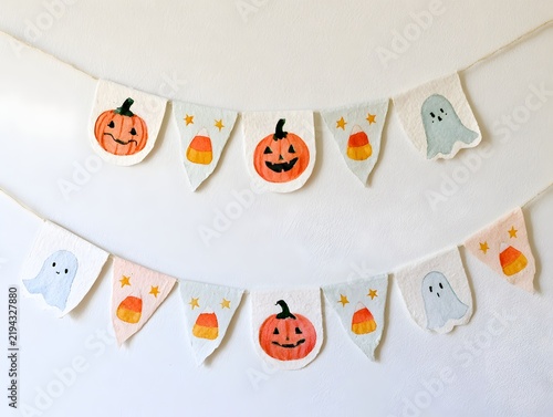 Handmade watercolor Halloween bunting with pumpkins ghosts and candy corn
