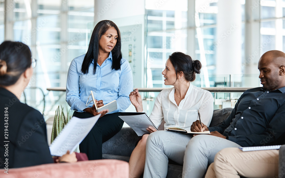 Obraz premium Business people, document and discussion in lobby for networking, collaboration and project review. Proposal, office and manager with employee and planning for b2b deal, paperwork or feedback