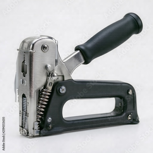 Black industrial staple gun for construction