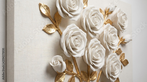 White plaster rose wall sculpture with metallic gold leaf foliage detailing