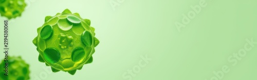 Green virus particles floating on a light green background with a soft gradient.