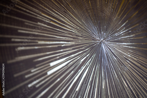 фотографія Abstract radial light streaks converging on a dark background