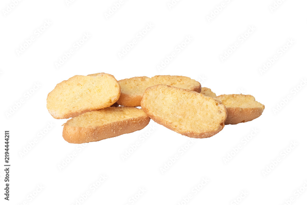 Fototapeta premium Crisp toasted oval bread rusk slices scattered on white background
