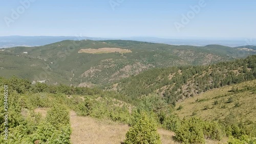 Panning shot of the nature landscape from Ljukten, the highest peak of mountain Goc, Serbia, on a clear sunny day