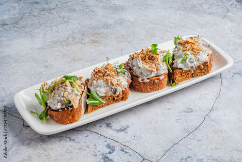 Bild auf Leinwand Delightful open-faced sandwiches topped with creamy goodness and crunchy topping