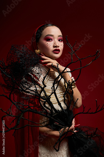Obraz na plátně Elegant vampire queen look with pearls and gothic flair for Halloween