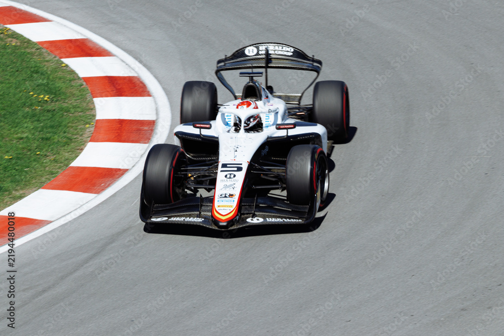 Obraz premium May 24, 2026, Montreal, Canada, Esteban Ocon races a Haas F1 car at Circuit Gilles-Villeneuve. g.