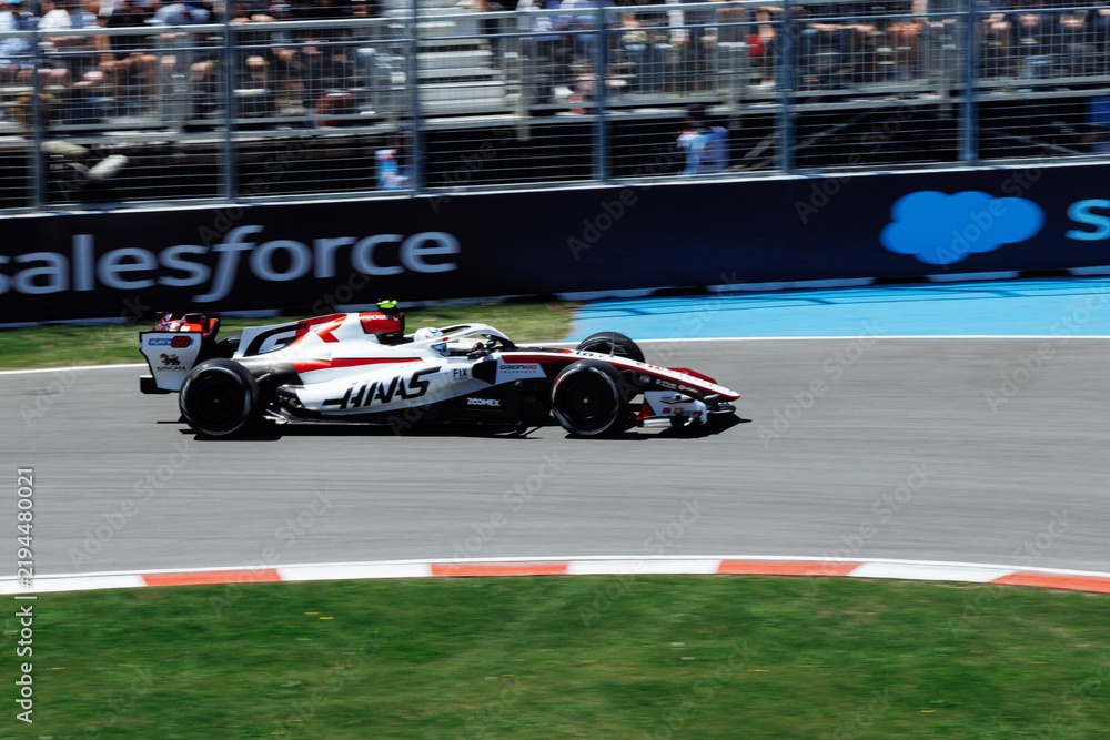 Obraz premium May 24, 2026, Montreal, Canada, Esteban Ocon races a Haas F1 car at Circuit Gilles-Villeneuve. g.
