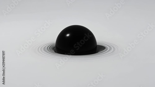Abstract video animation of a glossy black sphere partially submerged in pale liquid while smooth concentric ripples spread outward.