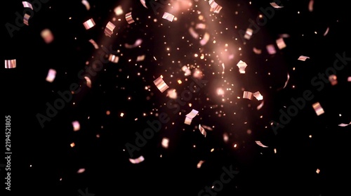 Rose gold confetti falling on black background