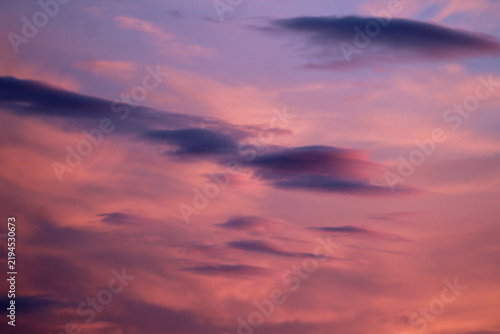 Beautiful pink and purple sunset sky filled with soft clouds, offering a tranquil atmospheric background ideal for nature, weather, travel, and design projects.