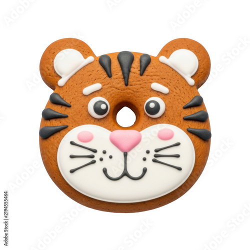 A cartoon tiger face with a pink nose and rosy cheeks