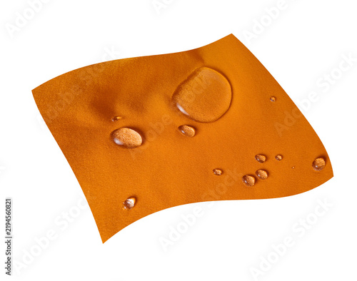 Obraz na płótnie Water drops on orange hydrophobic textile close-up on a transparent background