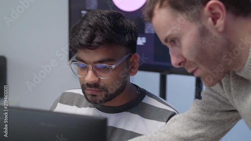 Software engineering use computer working develop AI office are assisting algorithm systems or verifying code. Programmer teamwork using artificial intelligence on laptop analysis or writing coding