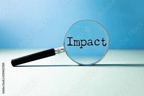 Impact word on white paper